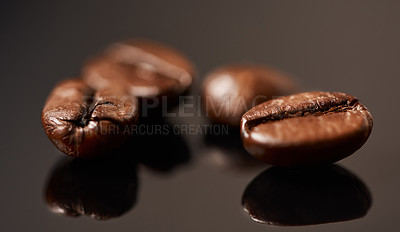 Buy stock photo Studio, product and fresh coffee beans on counter with caffeine, reflection and small business cafe. Espresso, grain and organic roast with flavor, aroma and local drink culture on black background