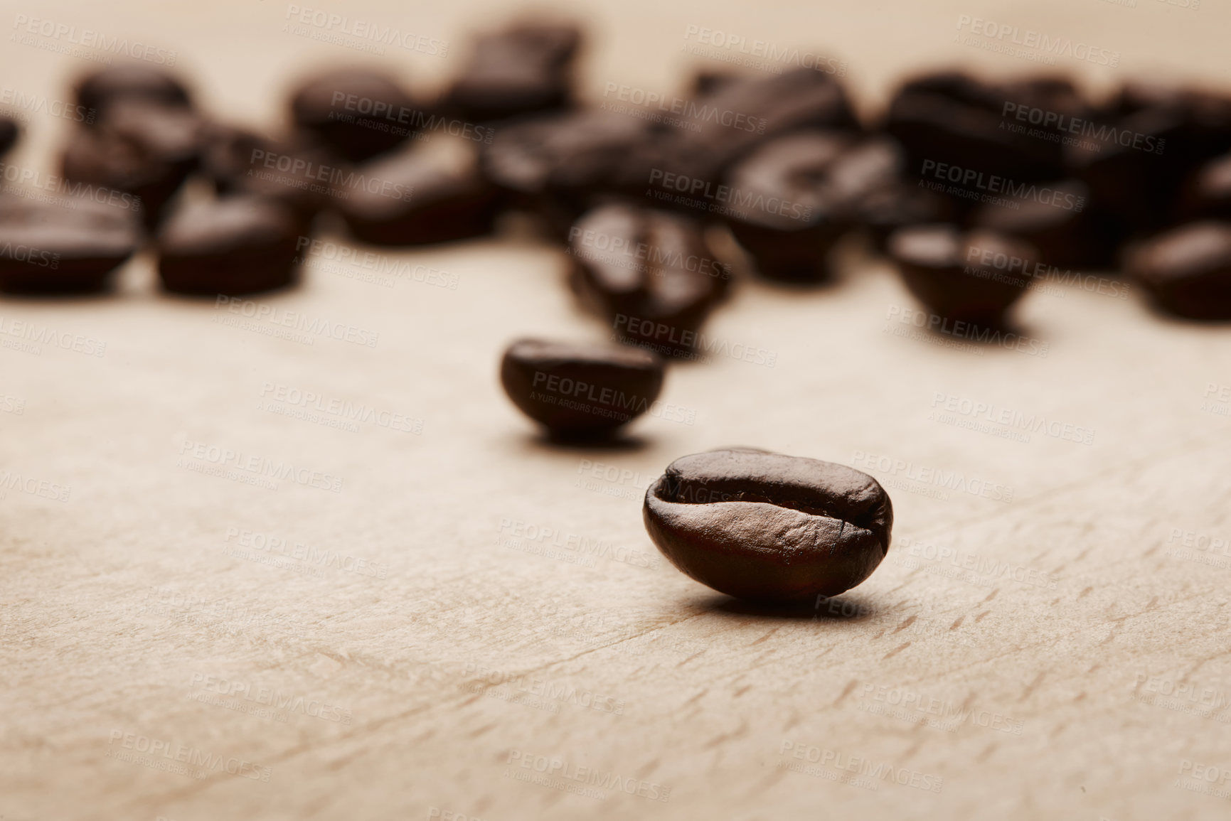 Buy stock photo Coffee beans, ingredients and closeup on table at factory, plant and quality assurance for export. Grain, texture and caffeine manufacturing with organic stock, product or sustainability at warehouse