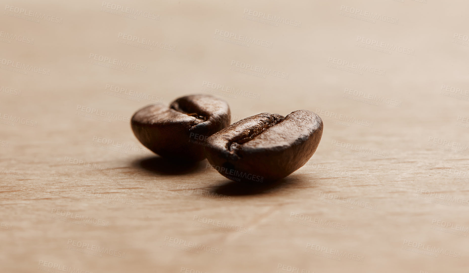 Buy stock photo Still life shot of coffee beans on a wooden countertop