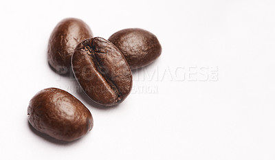 Buy stock photo Studio shot of coffee beans against a white background