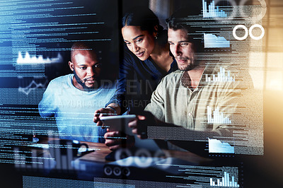 Buy stock photo Shot of a group of programmers using a digital tablet while working together on a computer code at night
