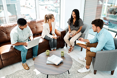 Buy stock photo Shot of a group of businesspeople having a discussion in an office