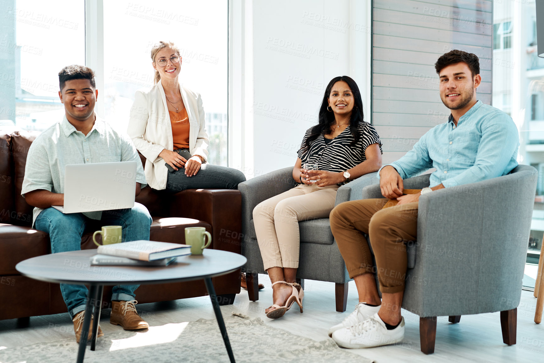 Buy stock photo Portrait of a group of businesspeople having a discussion in an office lounge