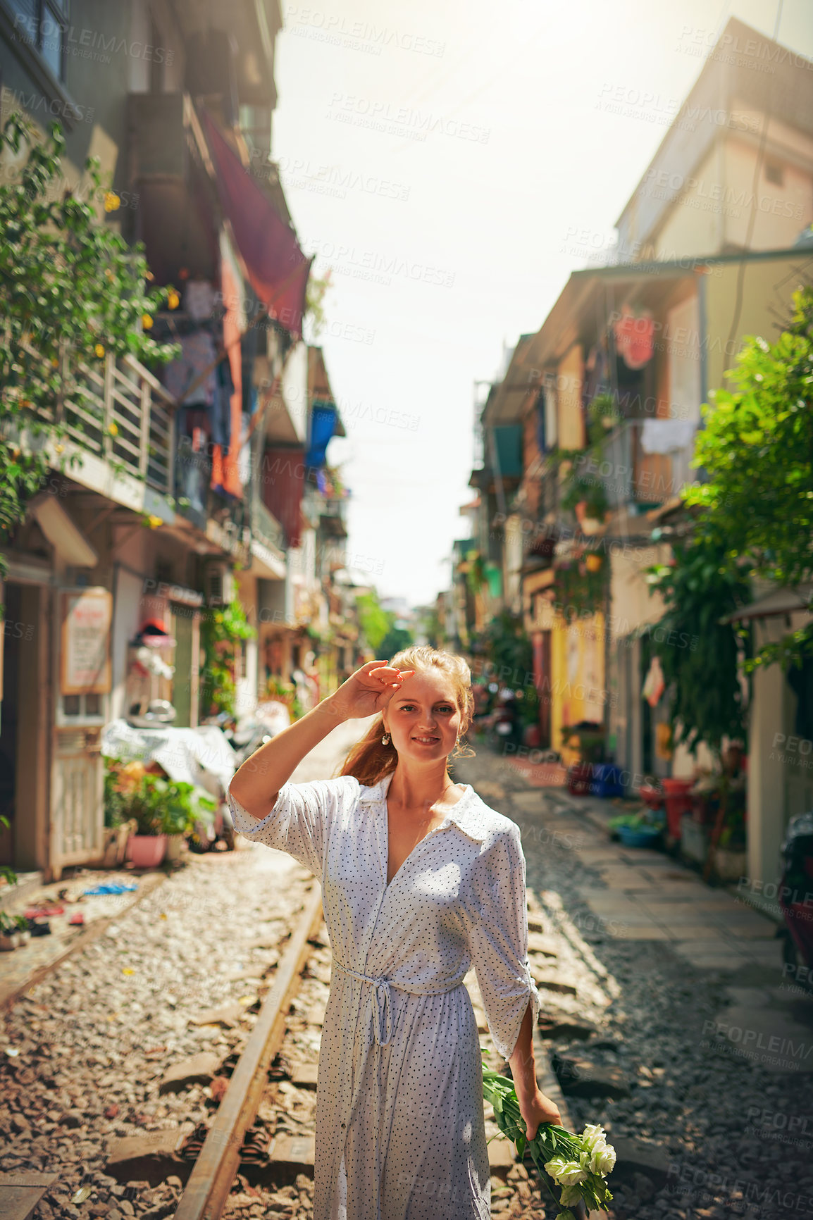 Buy stock photo Travel, market and portrait of woman on train tracks for holiday, vacation and adventure in Vietnam. Fashion, smile and person on railway for journey, tourist destination and sightseeing in city