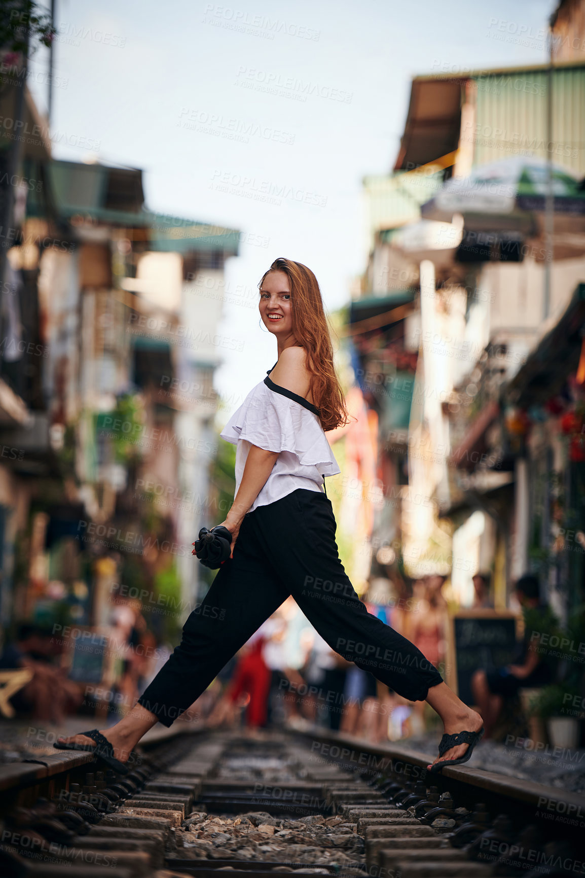 Buy stock photo Shot of a beautiful young woman exploring a foreign city