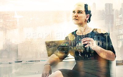 Buy stock photo Shot of a businesswoman sitting at her desk superimposed over a cityscape