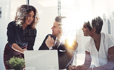 Buy stock photo Shot of a team of businesspeople in a meeting superimposed over a natural landscape