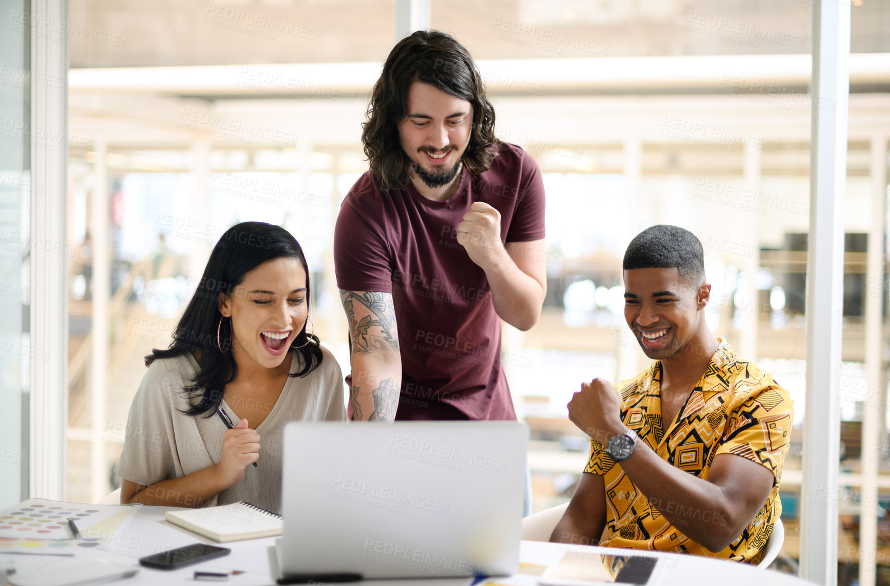 Buy stock photo Office, meeting and business people with celebration by laptop for research, information and achievement. Happy, excited and creative team with tech at desk for graphic design, success and web launch