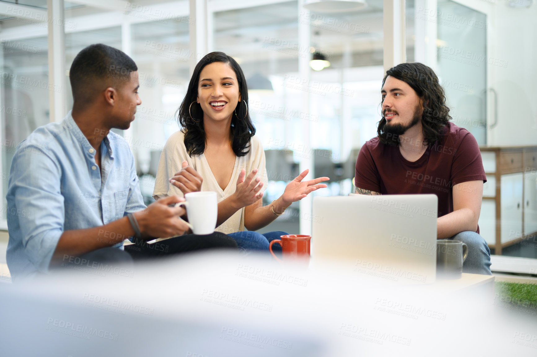 Buy stock photo Shot of a group of businesspeople having a discussion in an office