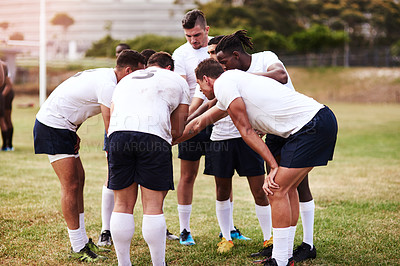 Buy stock photo Rugby, team and huddle for planning, motivation or sportsmanship on grass field outdoors. Sports, men hands together and collaboration for game, competition or training with workout and exercise