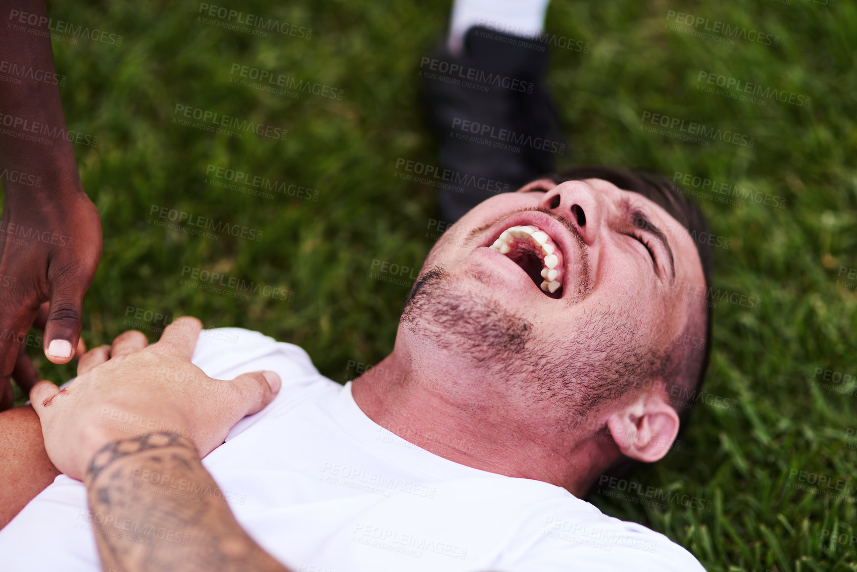 Buy stock photo Man, screaming and shoulder pain with sports injury on grass field for emergency, medical attention or accident. Male person, athlete or rugby player shouting with joint dislocation for foul or game