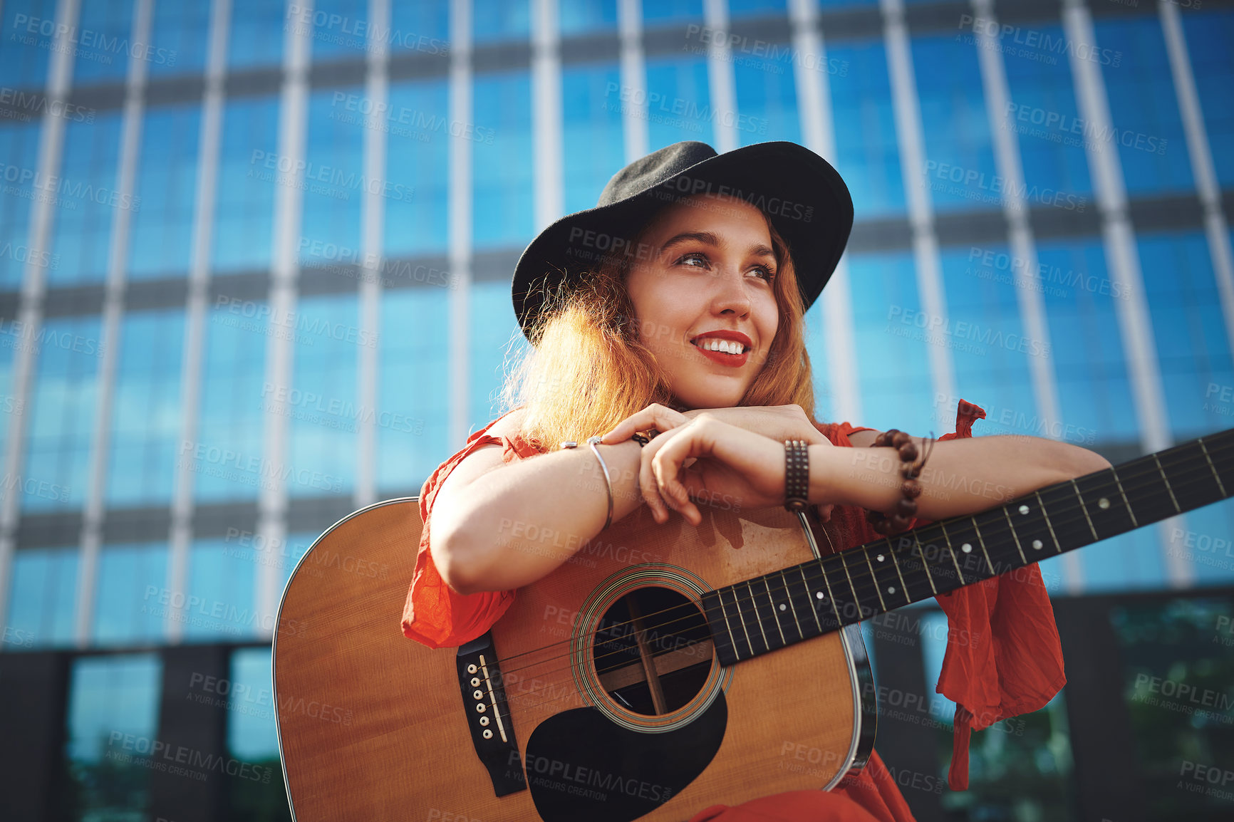 Buy stock photo City, woman and happy with guitar for music, playing and creative skill for jazz audio outdoor. Thinking, female person and guitarist with instrument for metal strings, acoustic musician and smile