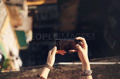 Buy stock photo Travel, phone screen and hands of woman with memory, buildings and outdoor city adventure on holiday. Digital photography, tourism and influencer girl on urban vacation with social media live stream