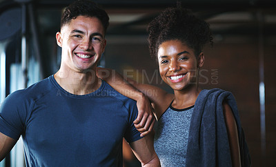 Buy stock photo Portrait of two sporty young people at the gym