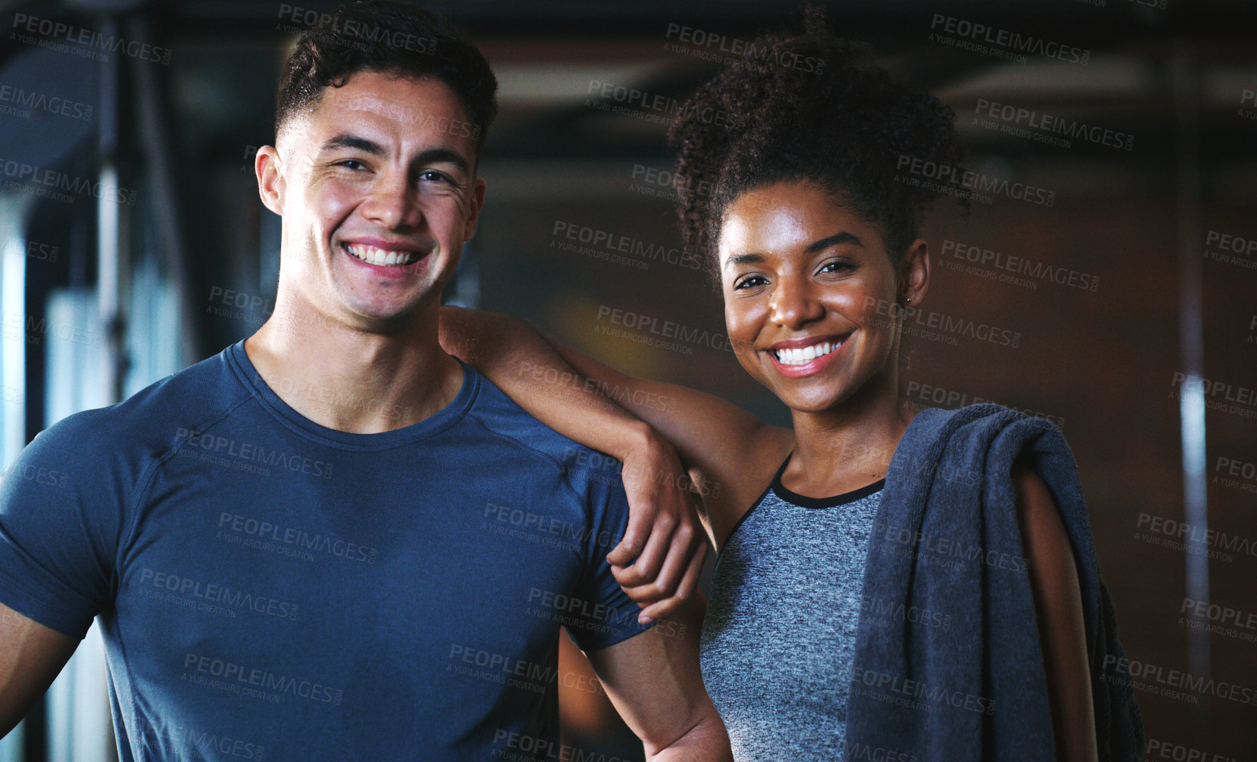 Buy stock photo Portrait of two sporty young people at the gym