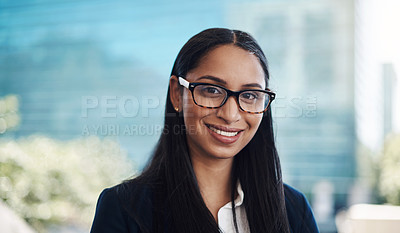 Buy stock photo Portrait of a confident young businesswoman against a city background