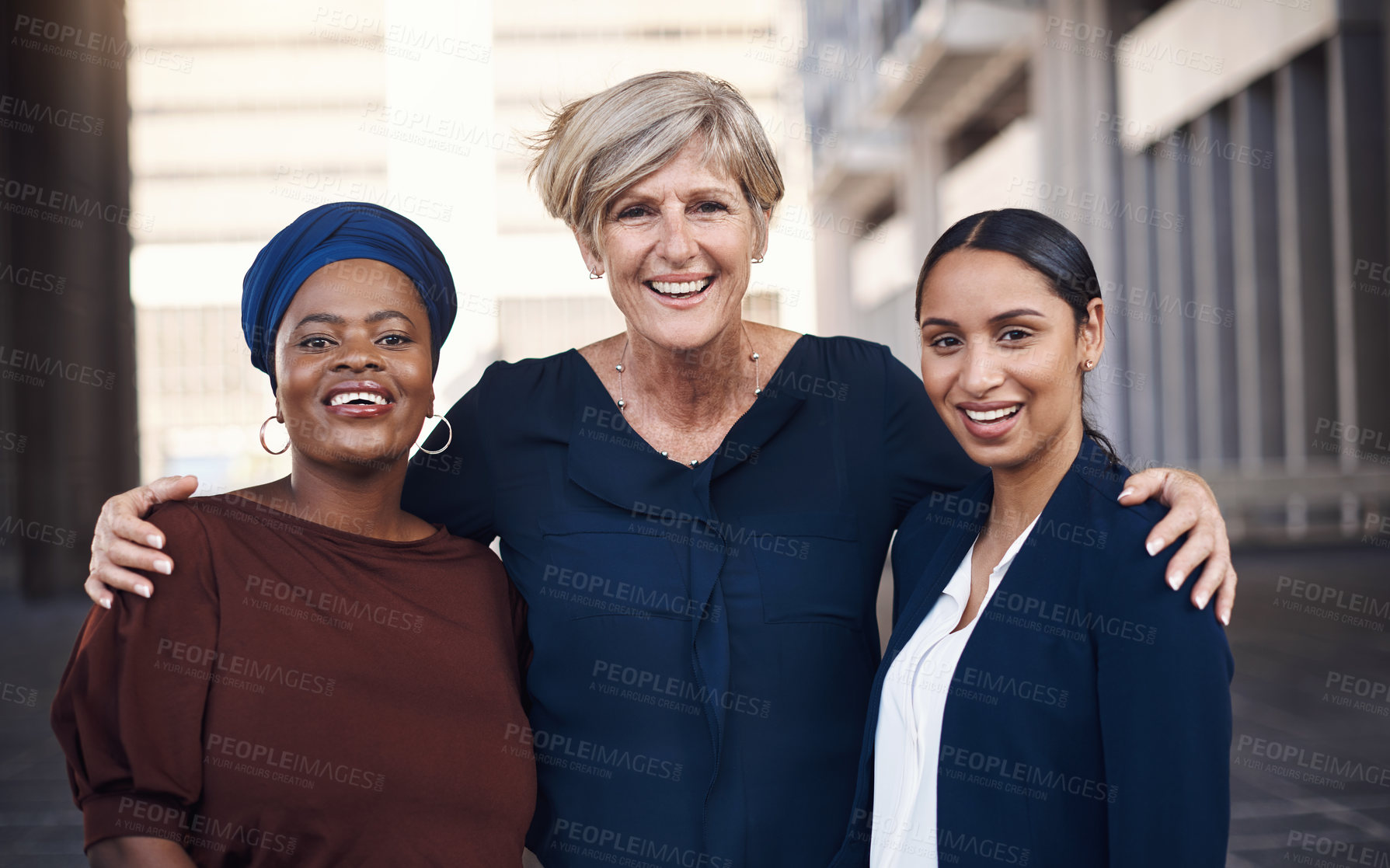 Buy stock photo Portrait of a group of businesswomen standing together against a city background