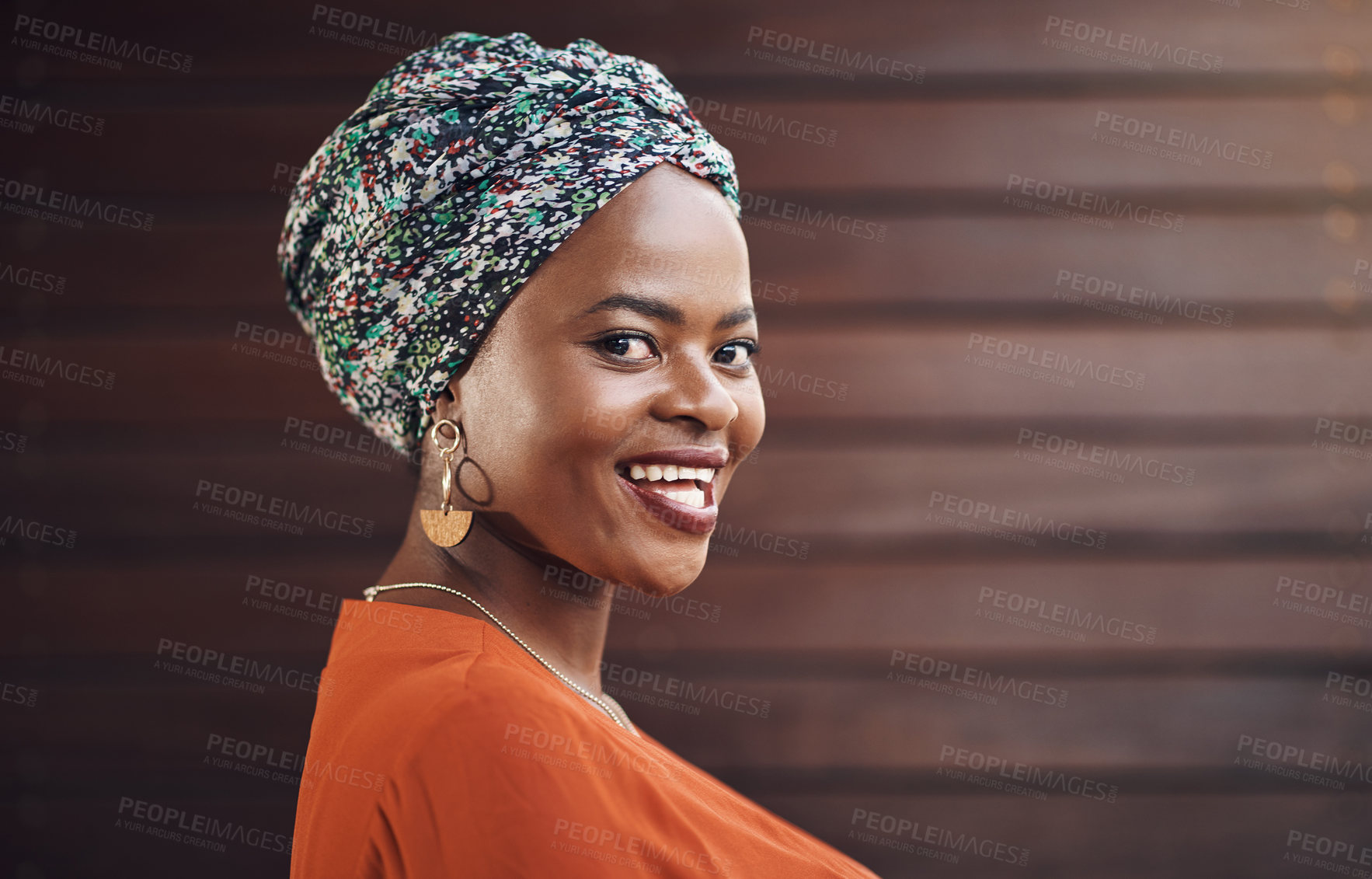 Buy stock photo Happy, creative and portrait of black woman by office with confidence for fashion career. Smile, pride and face of professional female designer with turban from Nigeria by wood wall in workplace.