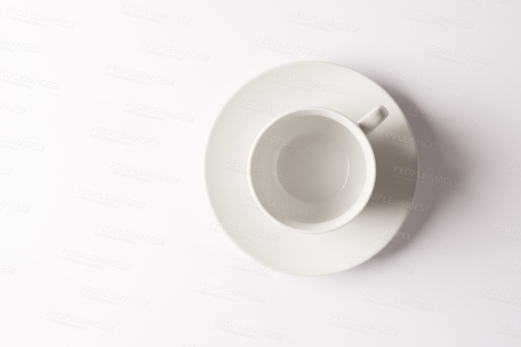 Buy stock photo Studio, space and empty coffee cup on saucer for cafe promo, kitchen hospitality or morning service. Mockup, minimal design and ceramic kitchenware for tea, drink and white background from above.