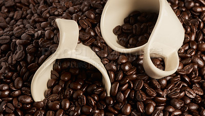 Buy stock photo Closeup shot of two cups on a pile of coffee beans