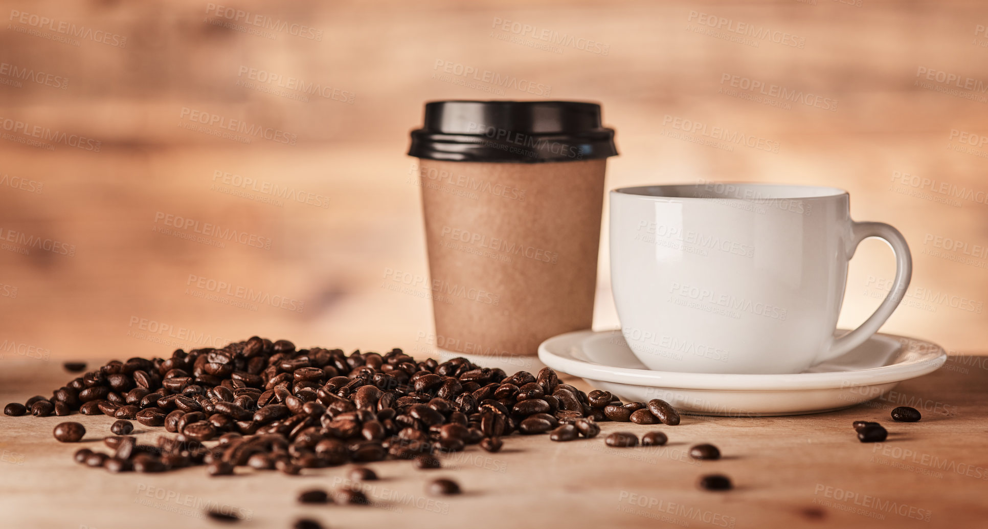 Buy stock photo Closeup shot of a paper cup and teacup surrounded by coffee beans