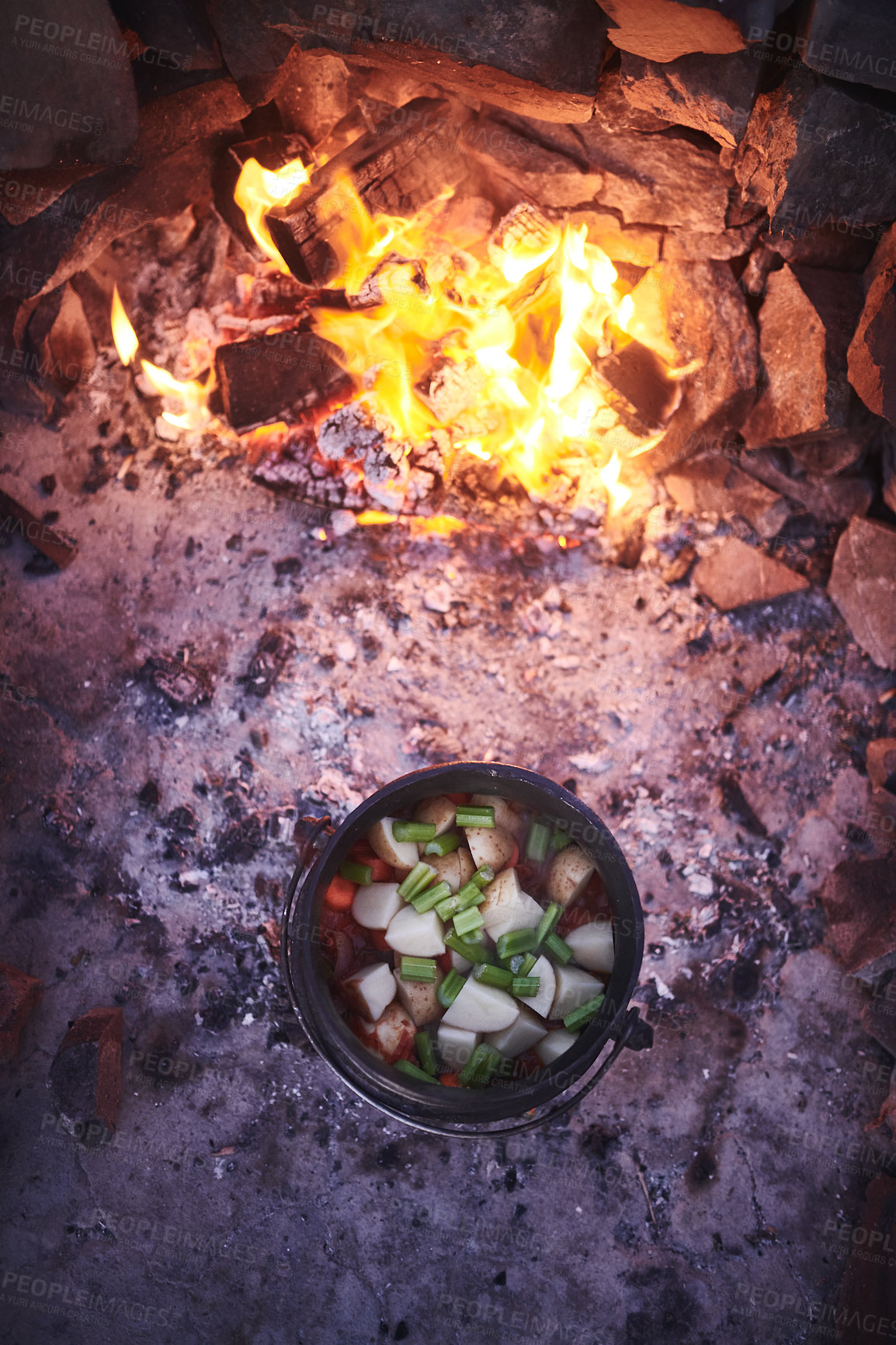 Buy stock photo Shot of a traditional South African food being cooked by campfire outdoors