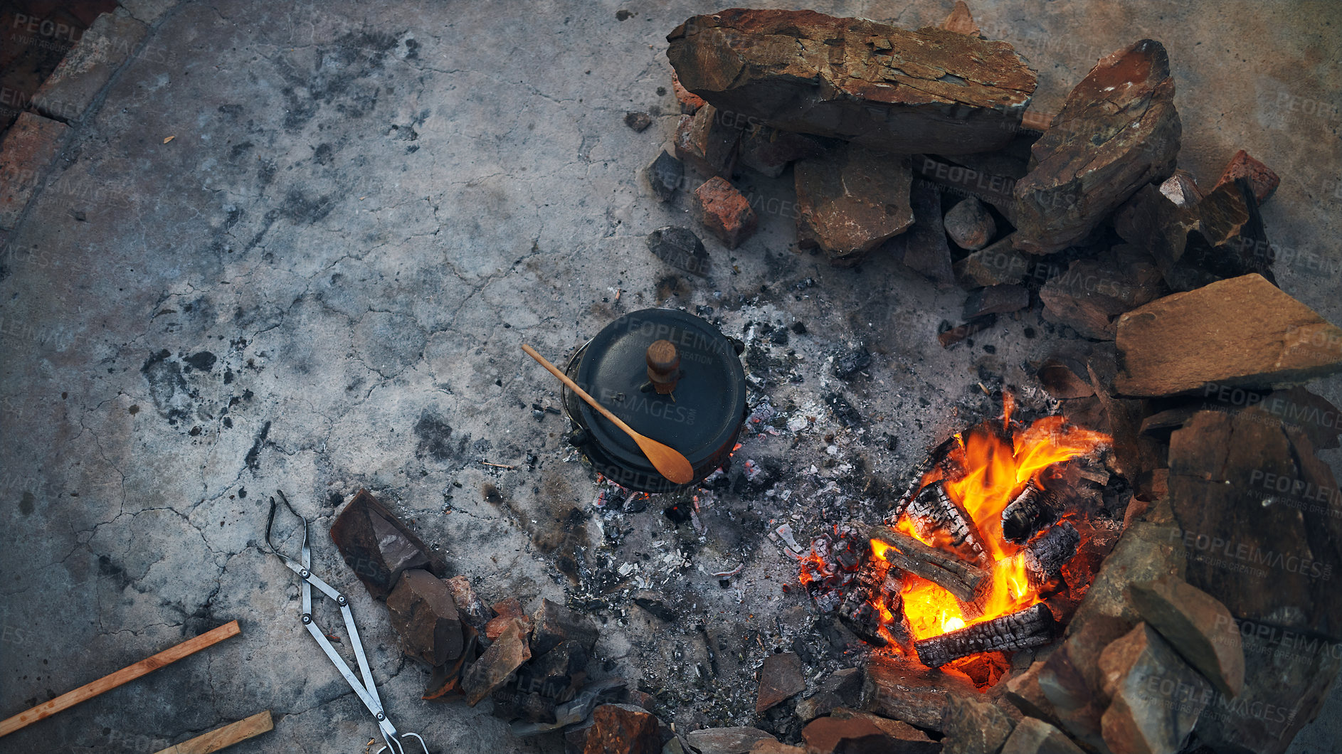 Buy stock photo Shot of a traditional South African food being cooked by campfire outdoors