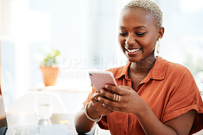 Buy stock photo Shot of a young businesswoman using a cellphone in an office