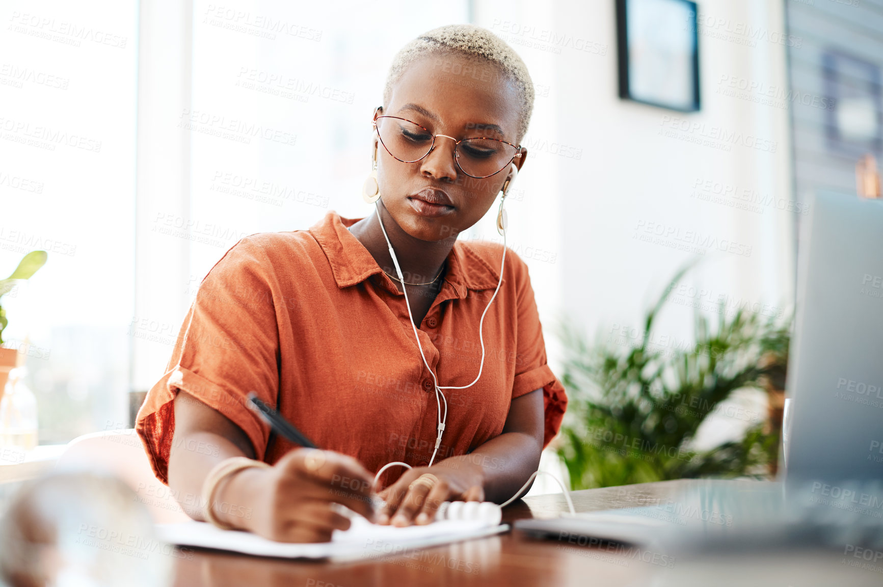 Buy stock photo Writing, business and black woman at desk with documents for assessment, contract or signature. Checklist, publicist and employee with earphones for listening to music, NDA or media release form