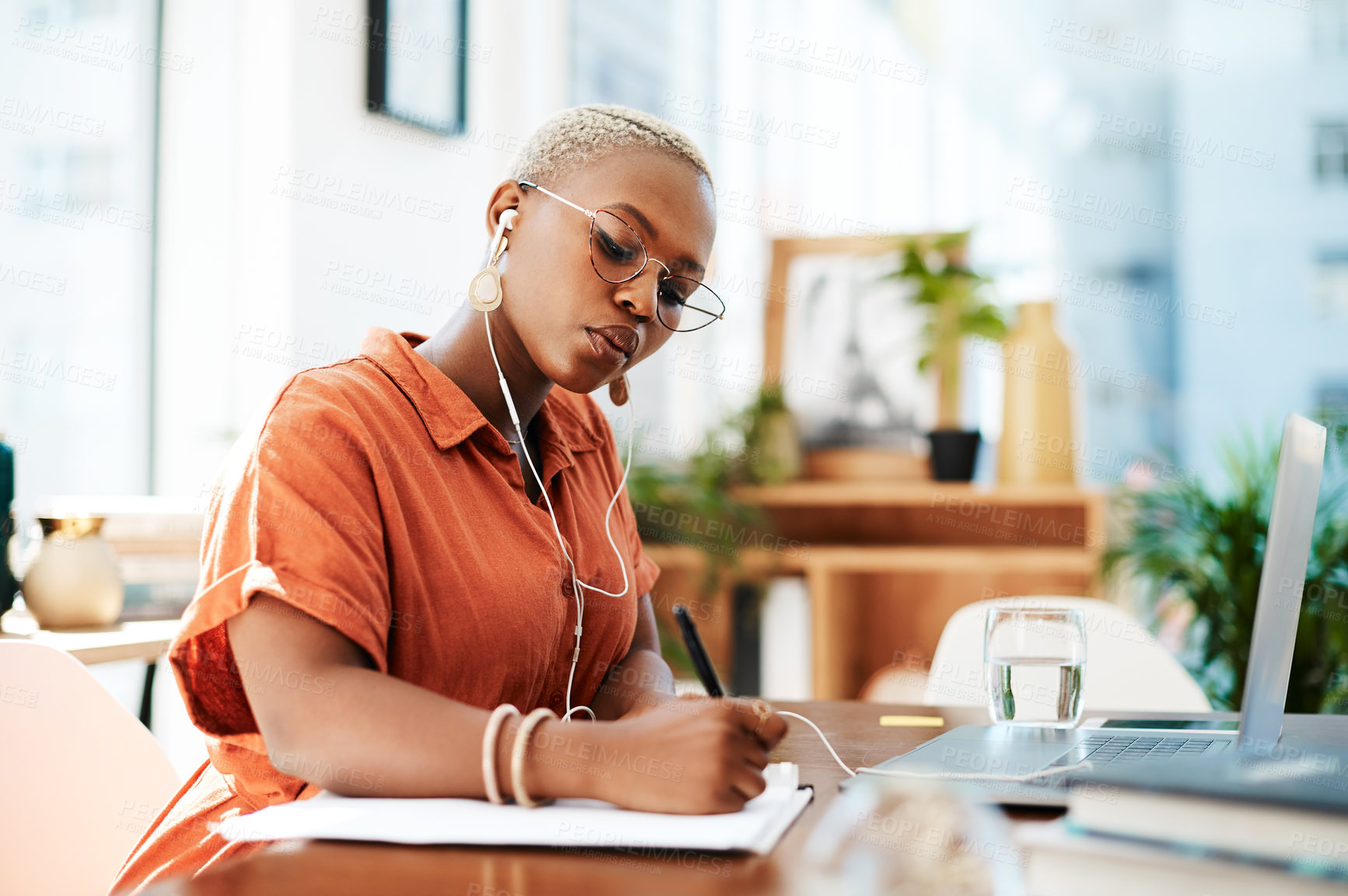 Buy stock photo Writing, business and black woman in office with documents for assessment, contract or signature. Checklist, publicist and employee with earphones for listening to music, NDA or media release form