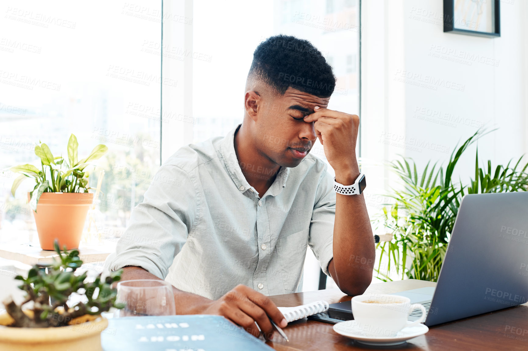 Buy stock photo African man, laptop and headache in modern office with stress, deadline or migraine for project at startup. Person, writer and tired by pc, exhausted and pain with editing process at creative agency