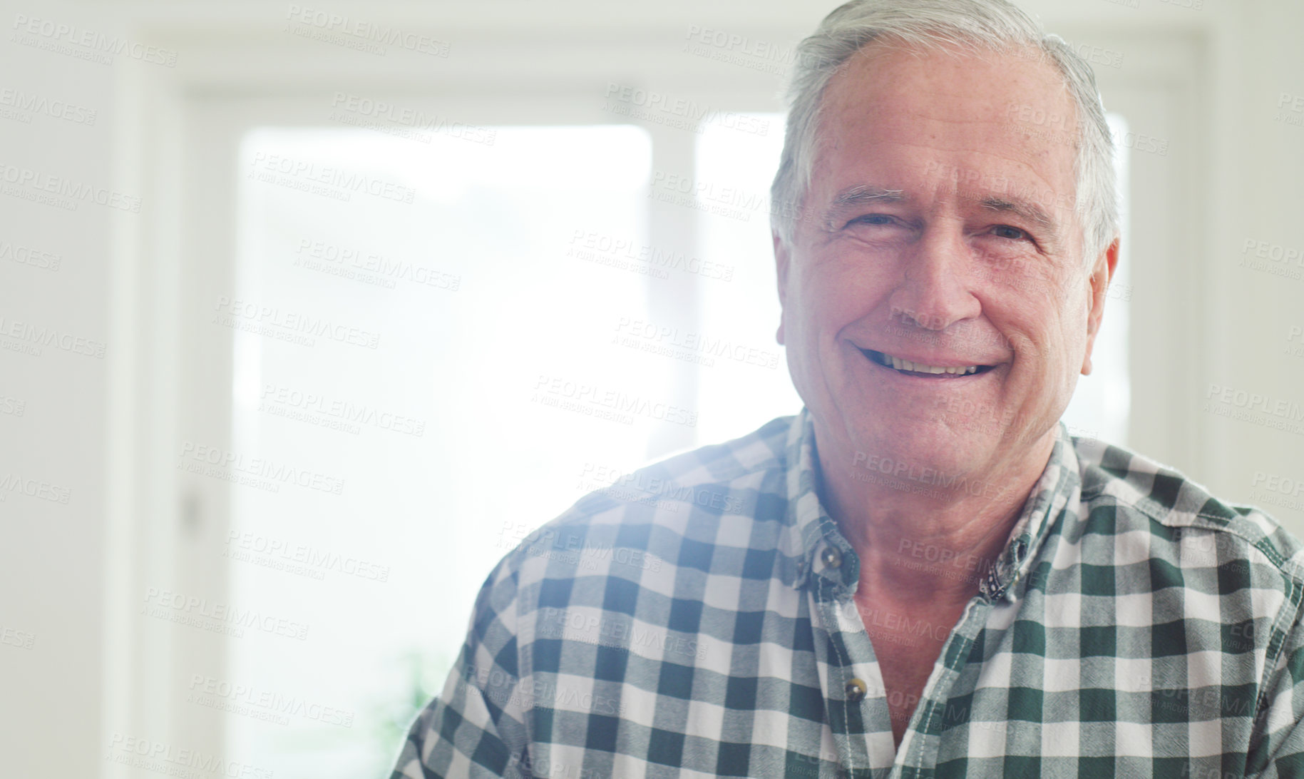 Buy stock photo Cropped shot of a happy senior man spending the day at home