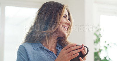 Buy stock photo Cropped shot of a beautiful woman enjoying a hot beverage at home