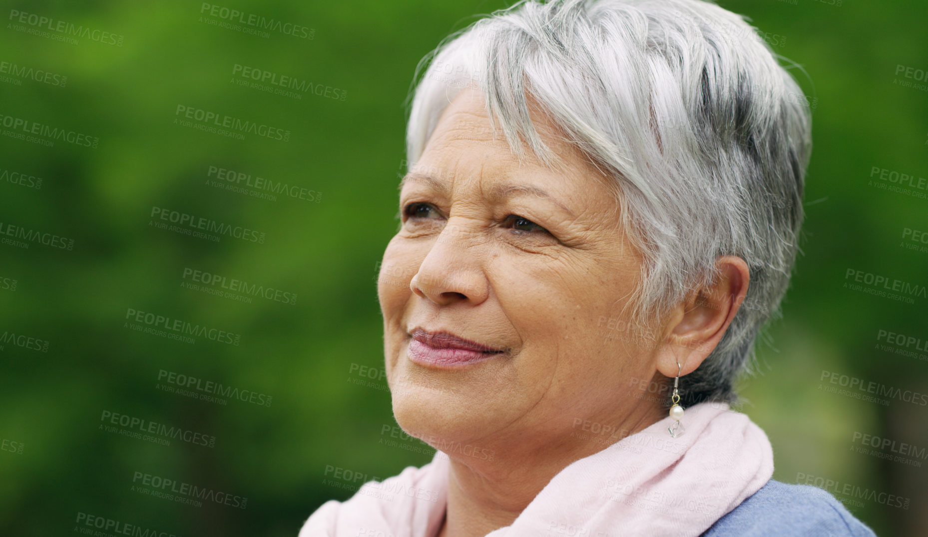 Buy stock photo Shot of a senior woman spending a day in the park