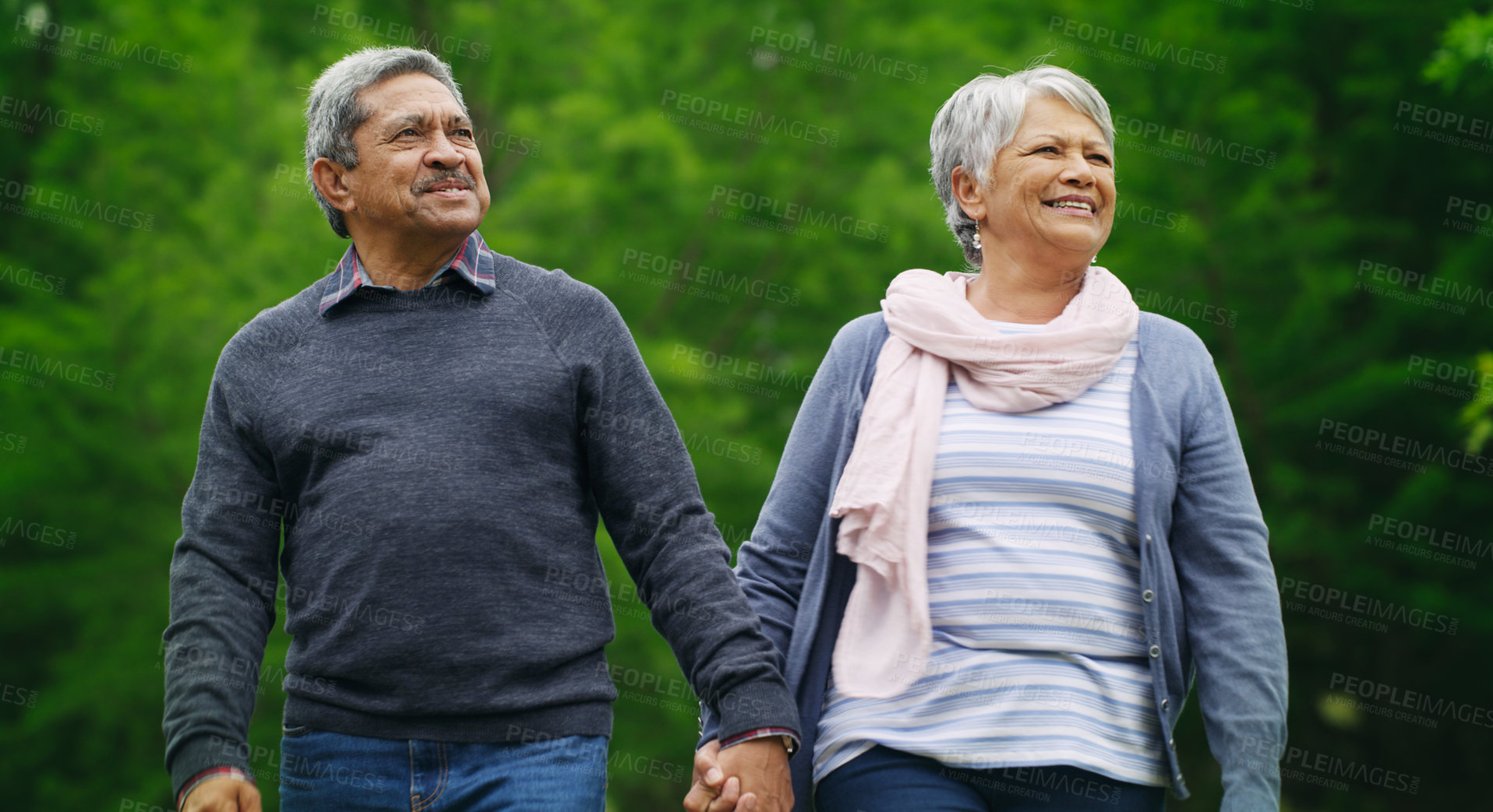 Buy stock photo Shot of a happy senior couple spending a romantic day in the park