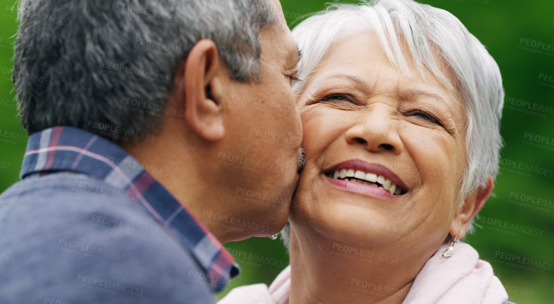 Buy stock photo Shot of a happy senior couple spending a romantic day in the park