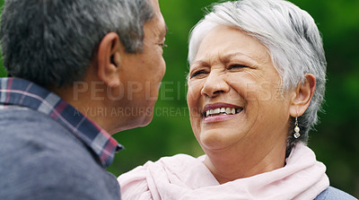 Buy stock photo Shot of a happy senior couple spending a romantic day in the park