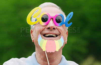 Buy stock photo Portrait of a senior man wearing fun glasses at the park