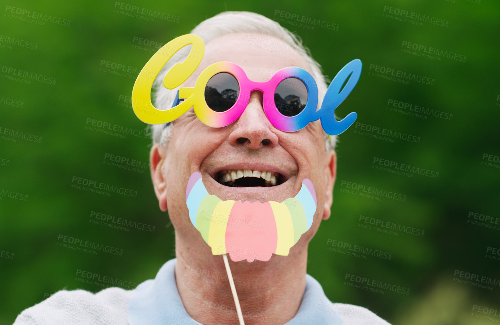 Buy stock photo Portrait of a senior man wearing fun glasses at the park
