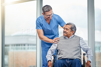 Buy stock photo Shot of a nurse helping a senior man in a wheelchair