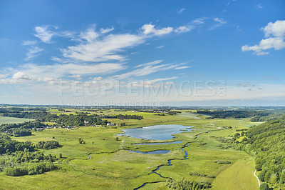 Buy stock photo Nature, lake and environment with drone of countryside for agriculture, farming and summer. Grass, travel and landscape with aerial view of meadow field and blue sky for growth, plants and ecology