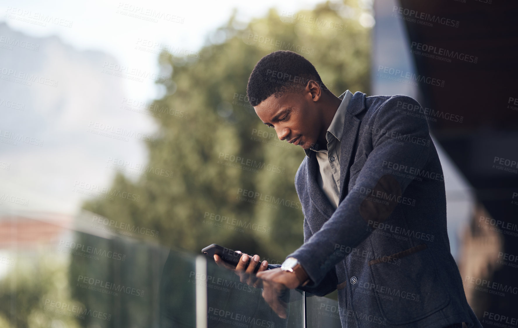 Buy stock photo Man, balcony and phone for online communication, conversation and networking client in office. Black person, professional lawyer and discussion on legal case, attorney and chat to business contact