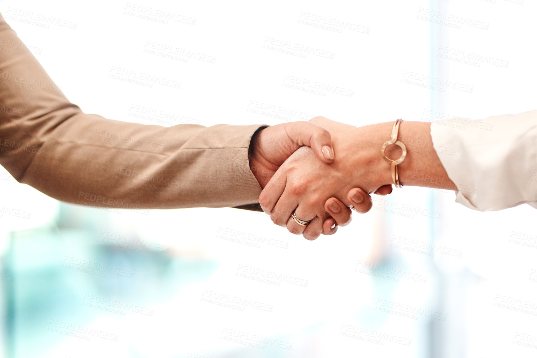 Buy stock photo Closeup shot of two unrecognisable businesspeople shaking hands