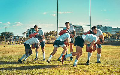 Buy stock photo Rugby, tackle and men in stadium for practice training, competition and game routine. Power, professional players and strong athletes on field for outdoor sports skills, workout or fitness exercise