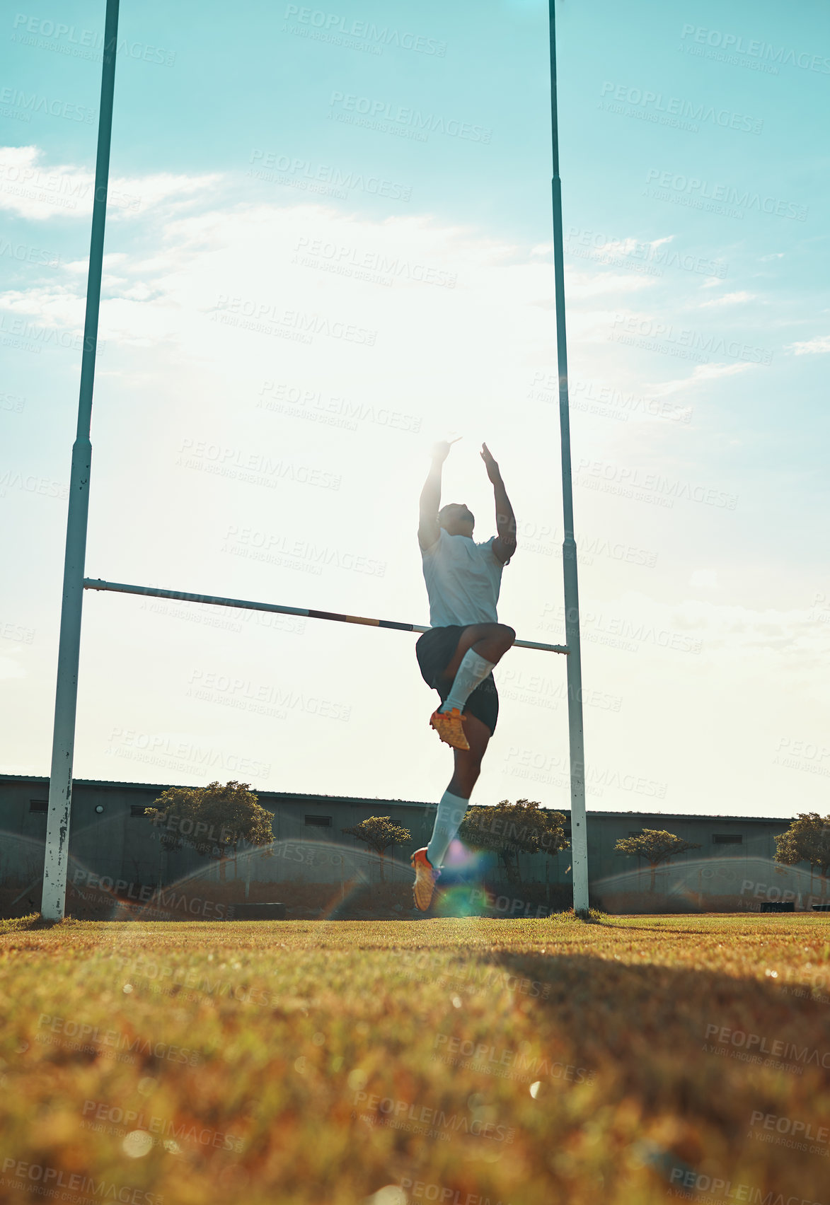 Buy stock photo Rugby, man and jump at posts for sport, catch and intense fitness game on field. Athlete, active or energy at goal poles for competition, professional tournament or World Cup event on pitch in summer