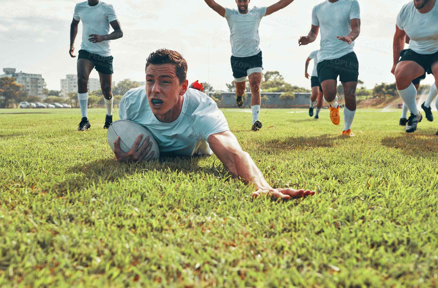 Buy stock photo Rugby, field and man with try on grass for outdoor sports game, practice or score in competition. Serious, athlete and player with ball in goal in exercise for fitness, workout or tournament training