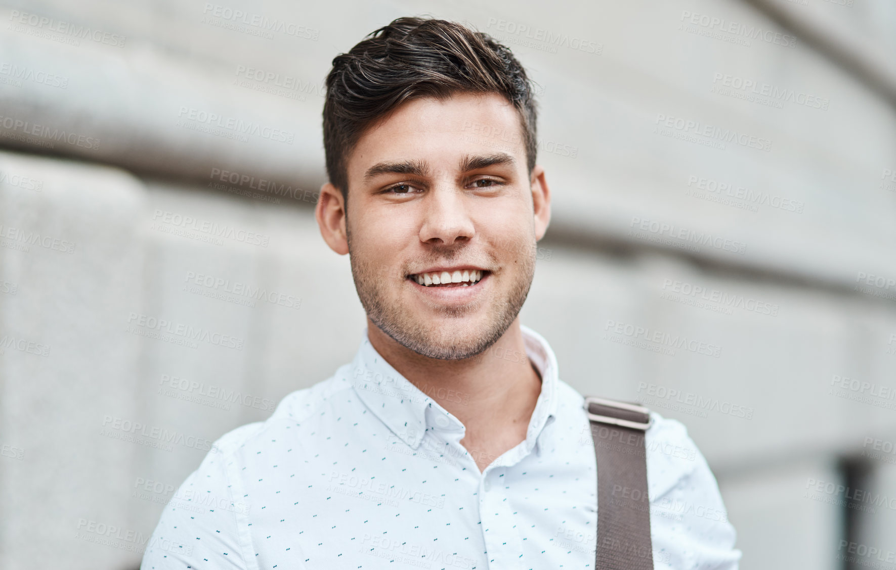 Buy stock photo Face of a happy, smiling and professional business man, entrepreneur or employee standing in the city. Portrait headshot of a charming male businessperson or guy looking confident in an urban town