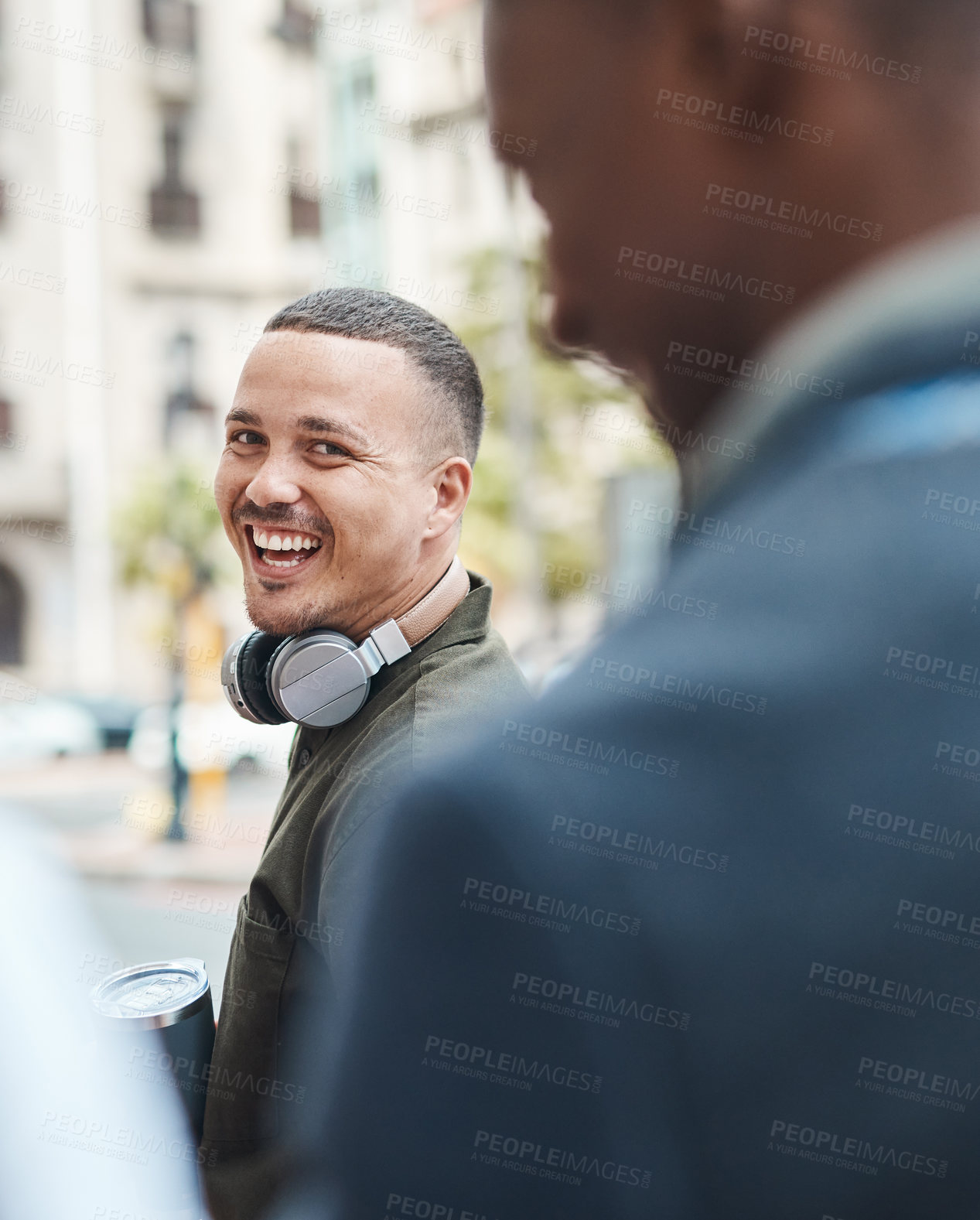 Buy stock photo Real life young man portrait in the street with headphones, enjoying music on a playlist app looking happy, stressless and cool. Normal face of a millennial with wireless tech outside an urban city