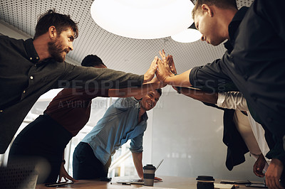 Buy stock photo Cropped shot of a group of business colleagues high fiving during a meeting in the boardroom