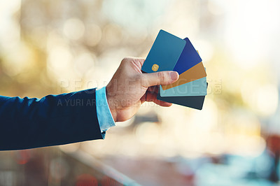 Buy stock photo Closeup shot of an unidentifiable businessman holding a selection of credit cards